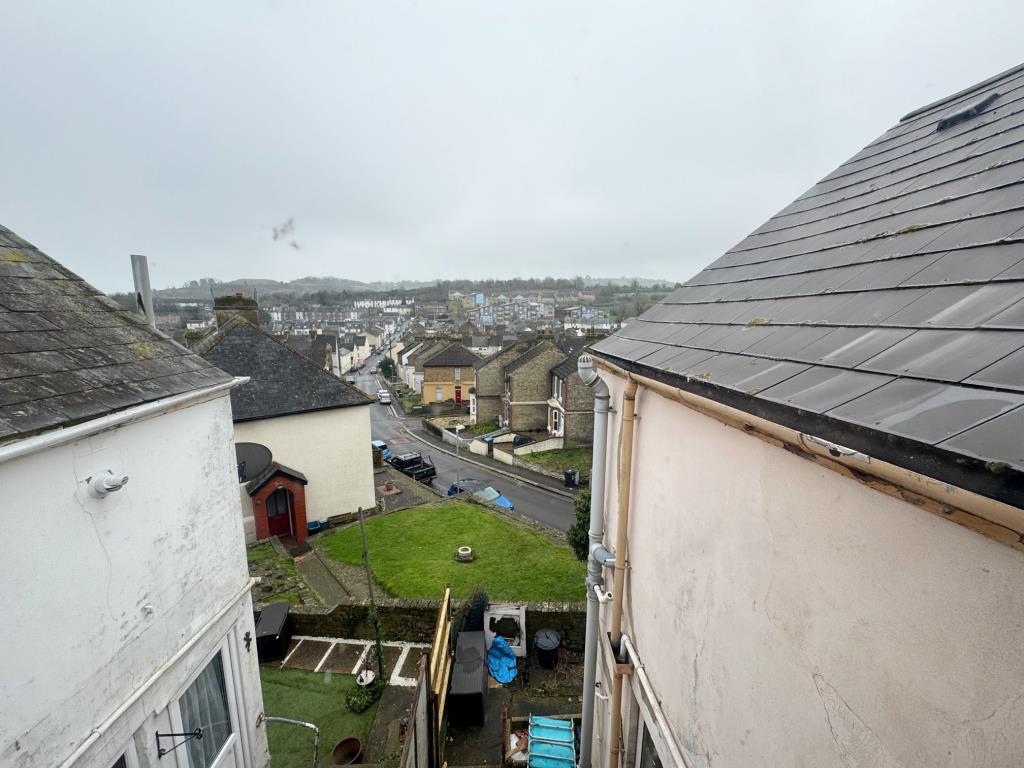 Lot: 138 - TWO-BEDROOM TERRACE HOUSE FOR IMPROVEMENT PLUS ADDITIONAL LAND - View from bedroom 2